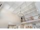 Bright, open living room showcasing a coffered ceiling, hardwood floors, and an upper-level landing at 2632 Jordan Pointe Blvd, New Hill, NC 27562