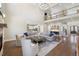 Open floor plan featuring a living room with fireplace, hardwood floors, kitchen, staircase, and a bar at 2632 Jordan Pointe Blvd, New Hill, NC 27562