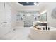 Luxurious main bathroom with marble floors, soaking tub, and glass enclosed shower at 2632 Jordan Pointe Blvd, New Hill, NC 27562
