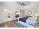 Serene main bedroom featuring a fireplace, TV, and bathroom access at 2632 Jordan Pointe Blvd, New Hill, NC 27562