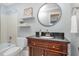 Updated bathroom with modern vanity, and decorative shelves at 2829 Patrie Pl, Raleigh, NC 27613