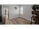 Minimalist bedroom with wood-look floors, a window, and horse themed decor at 310 Chub Lake St, Roxboro, NC 27573
