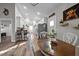 Dining area featuring wood table, stainless steel fridge, and bar seating at 310 Chub Lake St, Roxboro, NC 27573