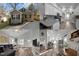 Charming home featuring gravel driveway, neutral siding, and black shutters against mature trees at 310 Chub Lake St, Roxboro, NC 27573