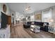 Open concept living room featuring a sectional sofa and seamless flow into the kitchen and dining area at 310 Chub Lake St, Roxboro, NC 27573