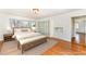 Staged bedroom with exterior views, carpet, and built in shelving at 32 Mt. Bolus Rd, Chapel Hill, NC 27514