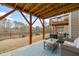Relaxing outdoor deck with comfortable seating and a beautiful view of the backyard at 368 Amber Acorn Ave, Raleigh, NC 27603