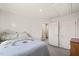Simple bedroom with a large window, neutral walls, and carpet flooring at 368 Amber Acorn Ave, Raleigh, NC 27603
