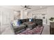 Inviting living room with a plush sectional sofa, area rug, and bright natural light at 368 Amber Acorn Ave, Raleigh, NC 27603