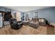 Spacious living room with a large sectional sofa, area rug, and a comfortable reclining chair at 368 Amber Acorn Ave, Raleigh, NC 27603