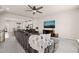 Cozy living room featuring an open floor plan, ceiling fan, and wall-mounted television at 368 Amber Acorn Ave, Raleigh, NC 27603