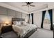Spacious main bedroom with tray ceilings, modern lighting, and large windows at 368 Amber Acorn Ave, Raleigh, NC 27603