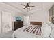 Relaxing main bedroom featuring modern lighting and a ceiling fan with mountain-view television at 368 Amber Acorn Ave, Raleigh, NC 27603