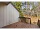 Back porch with wood flooring and view of the trees at 3775 Guess Rd # 36, Durham, NC 27705