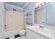 Charming bathroom with checkered tile flooring, tub and shower, and light blue walls at 3775 Guess Rd # 36, Durham, NC 27705