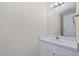 Well-lit bathroom with a white vanity and simple mirror at 3775 Guess Rd # 36, Durham, NC 27705