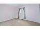 Bedroom with a window and neutral colored walls and carpeting at 3775 Guess Rd # 36, Durham, NC 27705