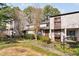 Inviting condo exterior with lush landscaping and a welcoming walkway at 3775 Guess Rd # 36, Durham, NC 27705