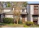 Exterior view of a charming townhouse with manicured landscaping at 3775 Guess Rd # 36, Durham, NC 27705