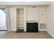 Bright living room showcases fireplace, built-in shelves, and glass doors to the outside at 3775 Guess Rd # 36, Durham, NC 27705