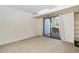 Living room features a sliding glass door with access to outdoor deck at 3775 Guess Rd # 36, Durham, NC 27705