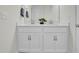 Contemporary bathroom featuring double sinks, white cabinetry, and sleek design, perfect for everyday use in the home at 380 Grameta Ln, Lillington, NC 27546