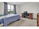 Cozy bedroom with a comfortable bed, a wooden desk and large window that provides ample natural light at 380 Grameta Ln, Lillington, NC 27546