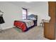 Comfortable bedroom featuring a cozy bed, a window and a wardrobe for a relaxing space in the house at 380 Grameta Ln, Lillington, NC 27546