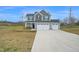 Charming two-story home with a three car garage and spacious front yard at 380 Grameta Ln, Lillington, NC 27546