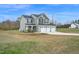 Charming two-story home with three car garage on large lot with mature trees at 380 Grameta Ln, Lillington, NC 27546