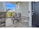Cozy front porch with two Adirondack chairs and stone accents at 380 Grameta Ln, Lillington, NC 27546