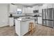 Modern kitchen featuring granite counters, stainless steel appliances, and kitchen island at 380 Grameta Ln, Lillington, NC 27546