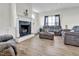 Bright living room with fireplace and hardwood floors at 380 Grameta Ln, Lillington, NC 27546