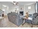 Spacious living room with fireplace, hardwood floors, and staircase at 380 Grameta Ln, Lillington, NC 27546