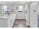 This main bathroom features double sinks, a large walk-in shower and a large linen closet at 380 Grameta Ln, Lillington, NC 27546