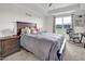 Spacious main bedroom boasts a tray ceiling, large windows, and a comfortable rocking chair at 380 Grameta Ln, Lillington, NC 27546