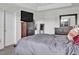 This main bedroom features neutral tones, a wooden dresser, and a door to the bedroom closet at 380 Grameta Ln, Lillington, NC 27546