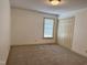 Comfortable bedroom with a window for sunlight and a closet for storage at 3901 Carson Dr, Sanford, NC 27332
