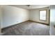 Bedroom featuring neutral colors, cozy carpet, and ample natural light through the window at 3901 Carson Dr, Sanford, NC 27332