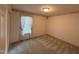 A cozy bedroom is carpeted and includes a window for natural light at 3901 Carson Dr, Sanford, NC 27332