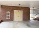 Attached carport featuring brick walls, concrete floors and double doors for storage at 3901 Carson Dr, Sanford, NC 27332