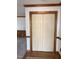 Hallway featuring wood trim and a closet with paneled bi-fold doors at 3901 Carson Dr, Sanford, NC 27332