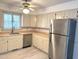 A well-lit kitchen with stainless steel appliances, butcher block counters, and neutral cabinets at 3901 Carson Dr, Sanford, NC 27332