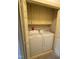 Convenient laundry closet with upper cabinets and a full-size washer and dryer at 3901 Carson Dr, Sanford, NC 27332
