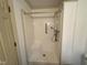 Shower area with an easy-to-clean surround, a grab bar, and an adjustable shower head at 3901 Carson Dr, Sanford, NC 27332