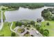 Aerial view of the estate with a lake and lush landscaping at 40 Park Meadow Ln, Youngsville, NC 27596