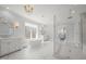 Bright bathroom with a glass shower, garden tub, and dual vanities at 40 Park Meadow Ln, Youngsville, NC 27596