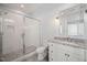 This bathroom features a large shower, granite countertop, and white cabinets at 40 Park Meadow Ln, Youngsville, NC 27596