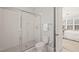 En-suite bathroom with tile shower, toilet and door to the main bedroom at 40 Park Meadow Ln, Youngsville, NC 27596