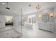 Bright bathroom features freestanding tub, glass shower, and dual sinks with vanities at 40 Park Meadow Ln, Youngsville, NC 27596